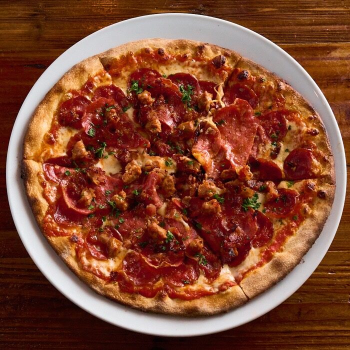Meat lover's pizza with hot Italian sausage, bacon, spicy salami and pepperoni
